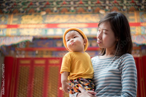 Chinese mother and son at temple