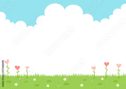 Heart flower plants on grass and sky background.