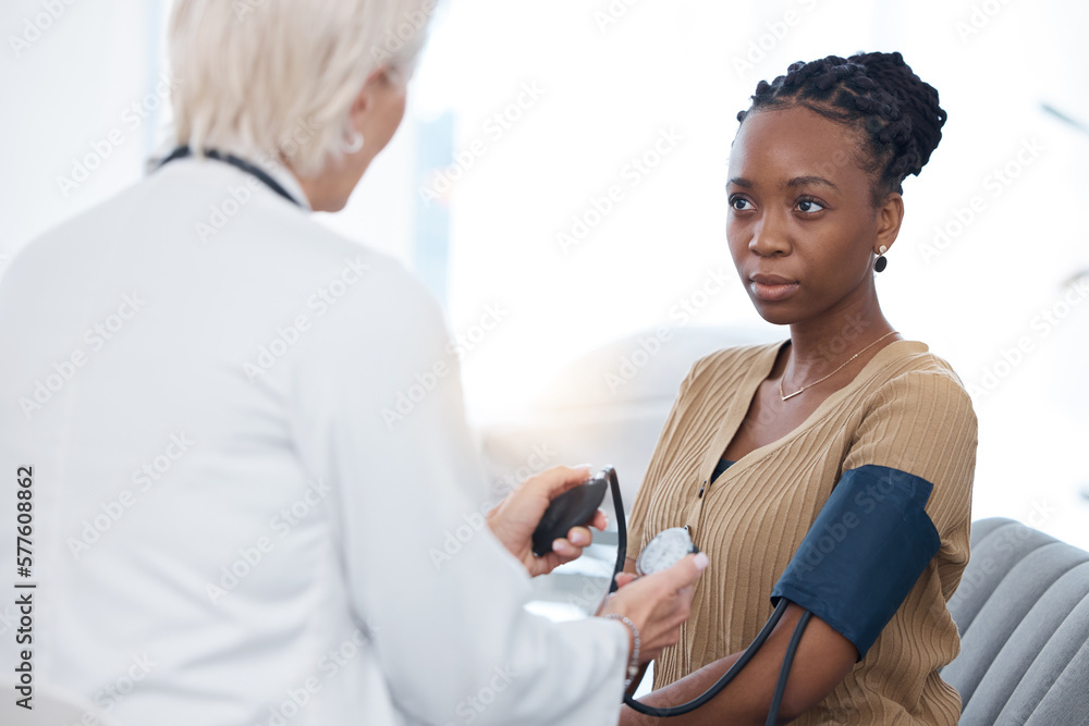 Obraz premium Healthcare, checkup and black woman with a doctor for blood pressure, hypertension and cardiology. Medical, service and African patient with a gp for a routine consultation to monitor the heart