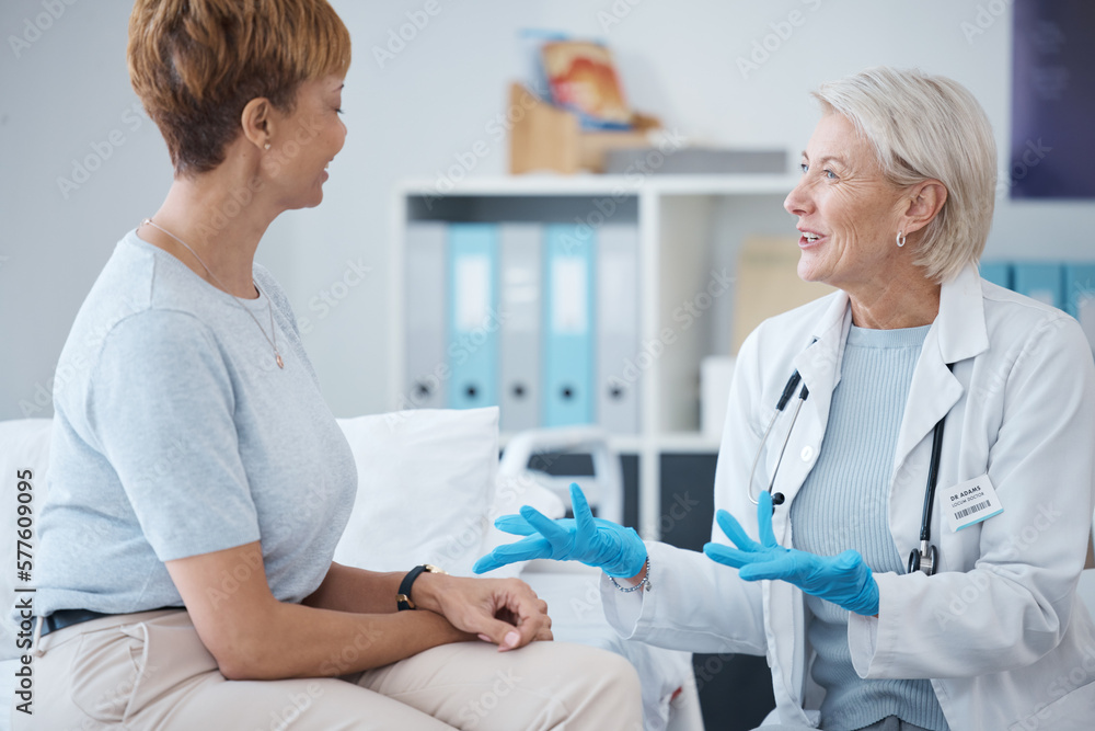 Obraz premium Consulting, healthcare and woman speaking to a doctor about a surgery, medical attention or plan. Support, medicine and mature patient talking to a gp about cardiology, strategy or health advice