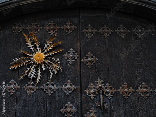 Eguzkilore en una puerta de Otsagabia en Navarra photo
