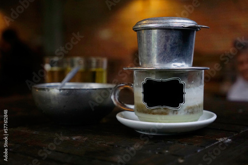 Vietnamese specialty dripping salted coffee cup with label stick                               photo