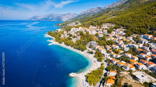 Fototapeta Naklejka Na Ścianę i Meble -  Witness the meeting of the Adriatic Sea and a rugged Croatian rocky slope, where the Pakleni islets and their crystal-clear turquoise waters can be admired from afar.