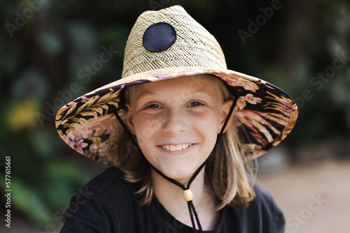 A young australian 11 year old girl wearing a sun smart wide brimmed hat