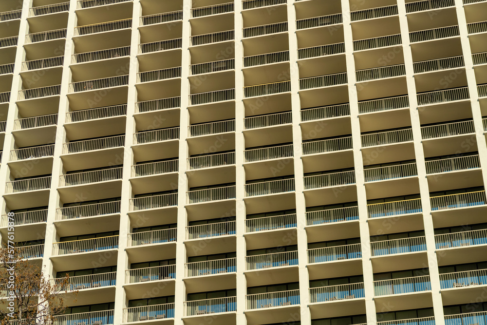 Complex matrix of apartment buildings in late afternoon sun with infinite rooms on massive building Complex matrix of apartment buildings in late afternoon sun with infinite rooms on massive building