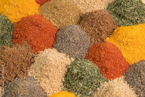 Spice and seasoning. Various fragrant spice market. Assortment spices and herbs for cooking. Heap different Asian Spices lies on wooden background