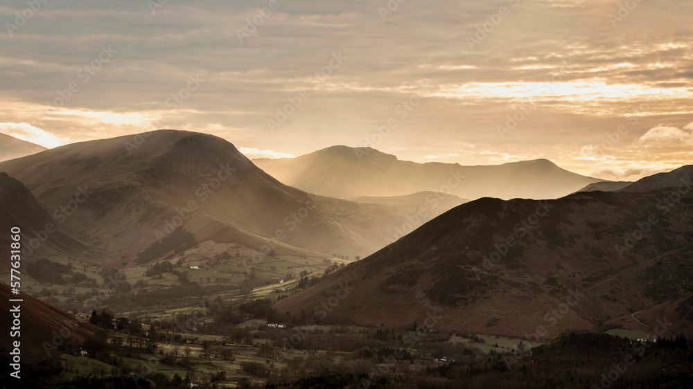Absolutely wonderful landscape image of view across Derwentwater from Latrigg Fell in lake District during Winter beautiful colorful sunset Absolutely wonderful landscape image of view across Derwentwater from Latrigg Fell in lake District during Winter beautiful colorful sunset