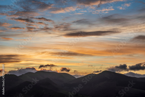 Absolutely wonderful landscape image of view across Derwentwater from Latrigg Fell in lake District during Winter beautiful colorful sunset