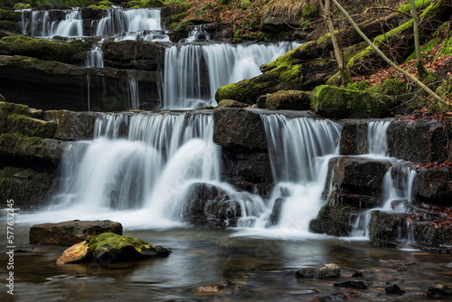 Beautiful calm landscape image of Scaleber Force waterfall in Yorkshire Dales in England during Winter morning