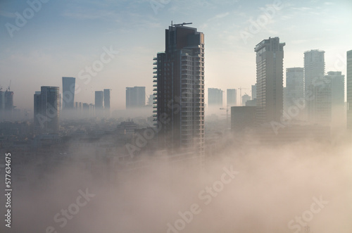 Heavy fog in Tel Aviv. View above. The city over the clouds