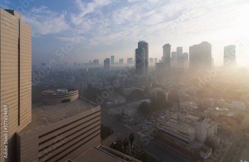 Heavy fog in sunny Tel Aviv. View above. The city over the clouds