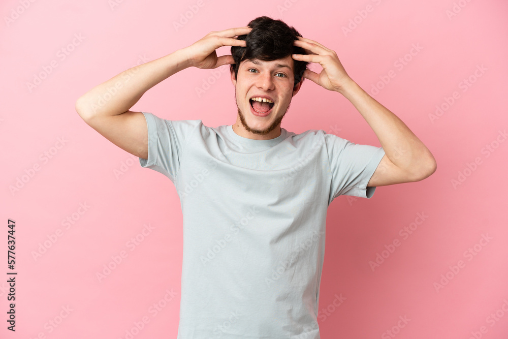 Young Russian man isolated on pink background with surprise expression Young Russian man isolated on pink background with surprise expression