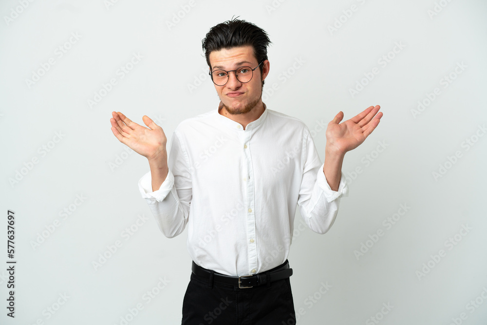 Russian Business man isolated on white background having doubts while raising hands Russian Business man isolated on white background having doubts while raising hands