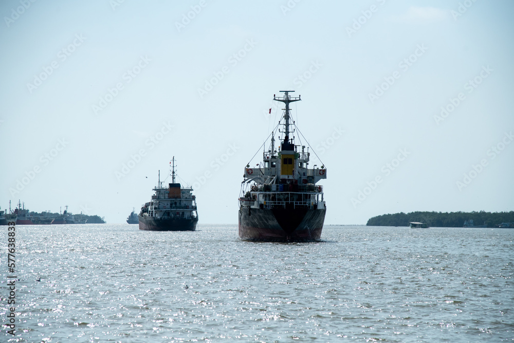 cargo ship on open water bay blue sky