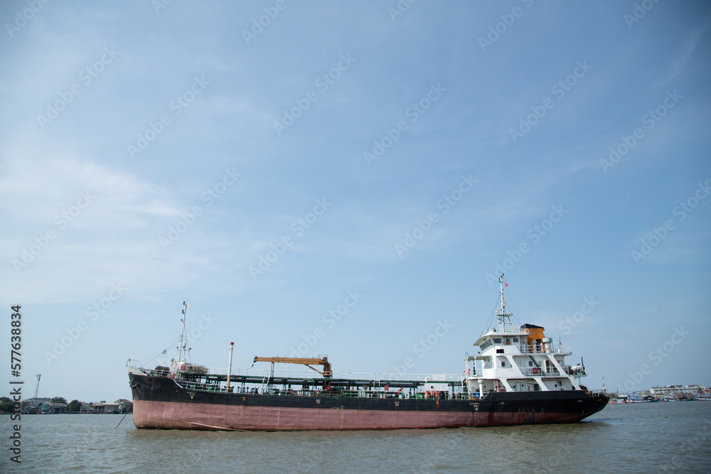 cargo ship on open water bay blue sky