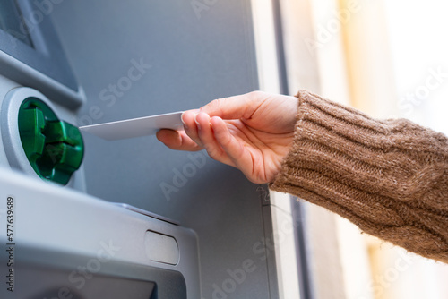 Young woman holding a credit card at outdoors