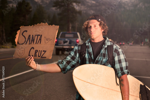 Surfer hitch-hiking