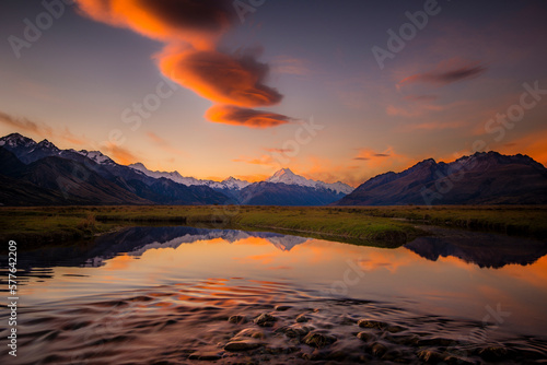 Still lake and mountains with colorful sky at sunrise in New Zealand. photo