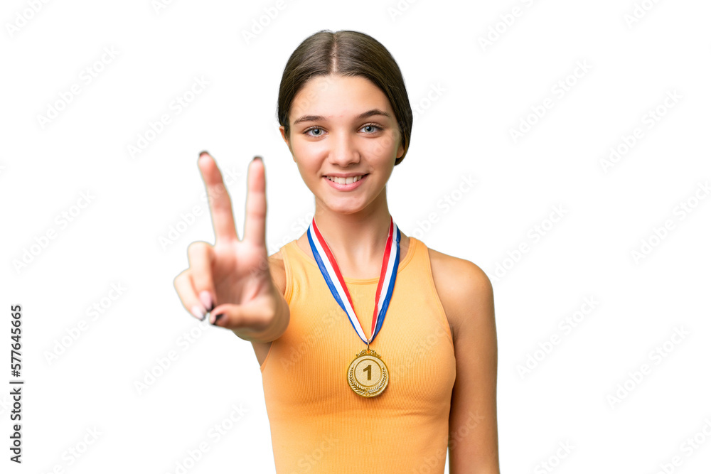 Teenager caucasian girl with medals over isolated background smiling and showing victory sign Teenager caucasian girl with medals over isolated background smiling and showing victory sign