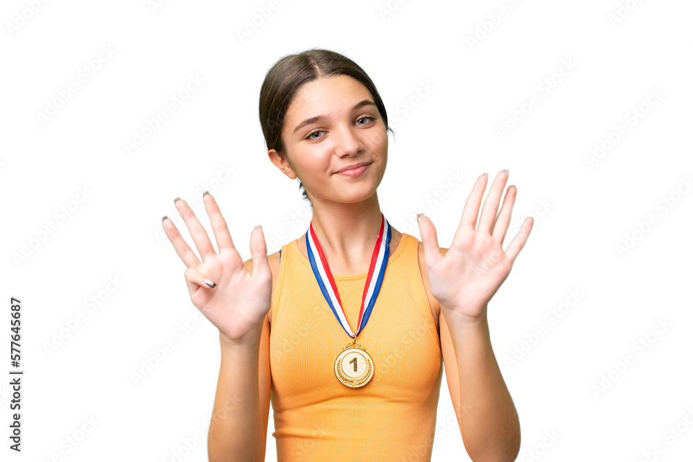 Teenager caucasian girl with medals over isolated background counting nine with fingers Teenager caucasian girl with medals over isolated background counting nine with fingers