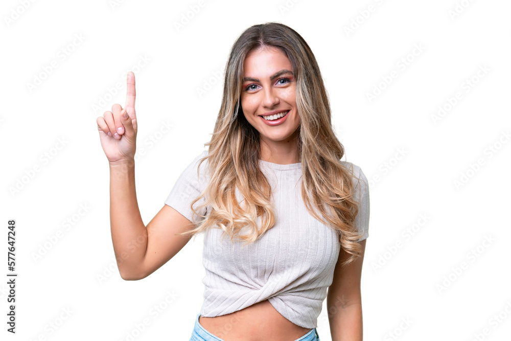 Fototapeta premium Young Uruguayan woman over isolated background pointing up a great idea