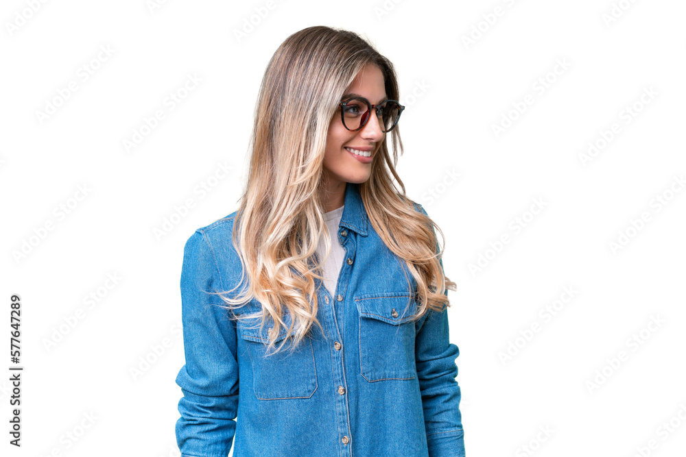 Young Uruguayan woman over isolated background looking to the side Young Uruguayan woman over isolated background looking to the side