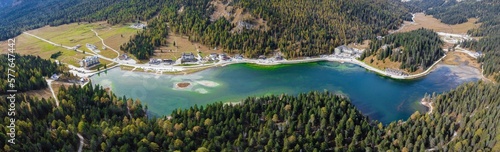 Fototapeta Naklejka Na Ścianę i Meble -  Aerial drone. Lake Misurina in the Italian Dolomites near Cortina D'Ampezzo. Sunny summer day with blue sky and clouds