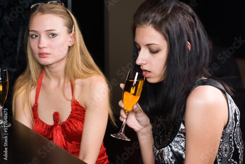 young women enjoying a drink at a bar