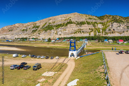 Southern Urals, Bashkiria: the Zilim River near the village of Tash-Asty, the Ukly Kaya rock, the tourist attraction Heart of Bashkiria. Aerial view. photo