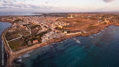 Aerial drone. Rocky coastline and island at Portopalo di Capo Passero, Siracusa Province, Sicily. photo