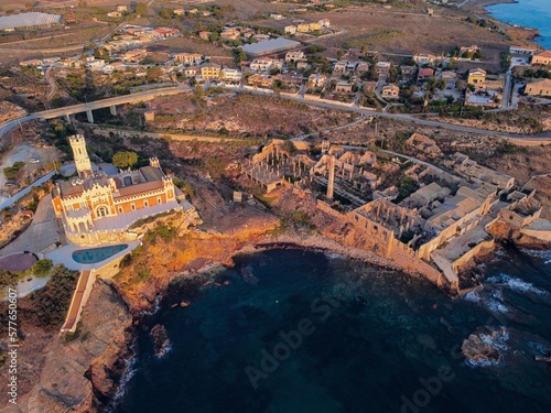 Aerial drone. Rocky coastline and island at Portopalo di Capo Passero, Siracusa Province, Sicily. photo