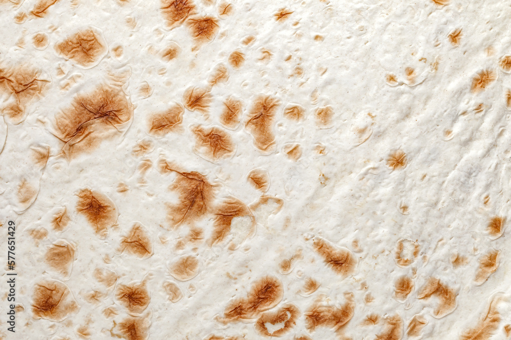 Pita bread handmade in tandoor close-up structure, background wallpaper, uniform texture pattern