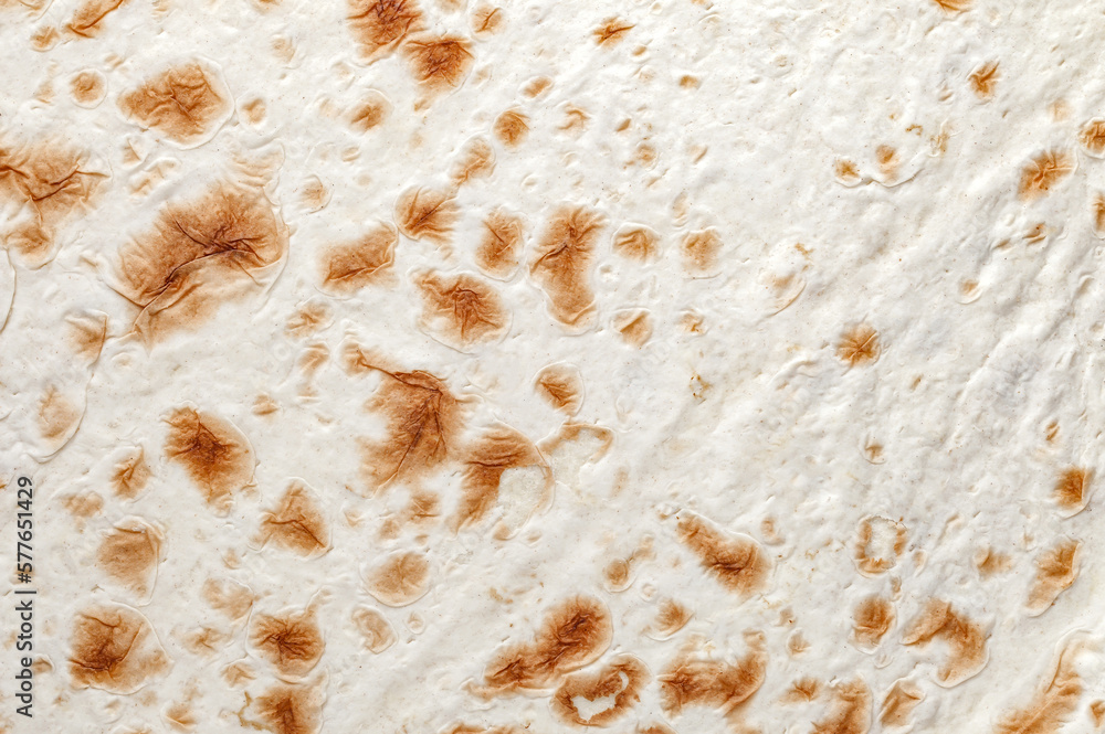 Pita bread handmade in tandoor close-up structure, background wallpaper, uniform texture pattern Pita bread handmade in tandoor close-up structure, background wallpaper, uniform texture pattern