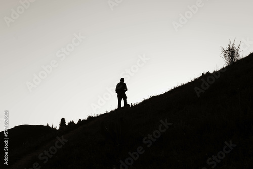 silhouette of a person on a mountain