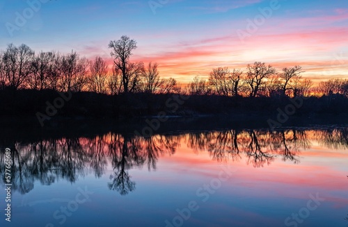 Scenic view of lake against sky during sunset © Daniel