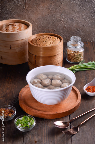 Chinese meatball soup are made of beef or pork of fish isolated on wooden background
