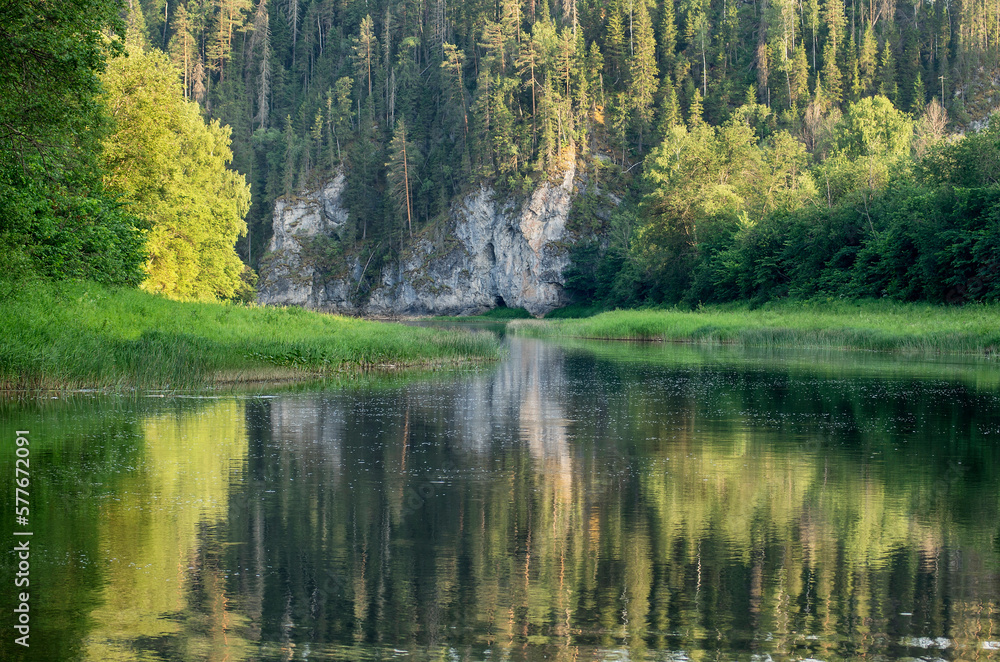 Southern Urals in summer, mountain river Zilim near the Kinderlin cave. Southern Urals in summer, mountain river Zilim near the Kinderlin cave.