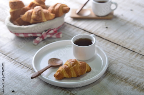 A croissant is a buttery, flaky pastry with yeast-leavened laminated dough isolated on white backhground
 photo