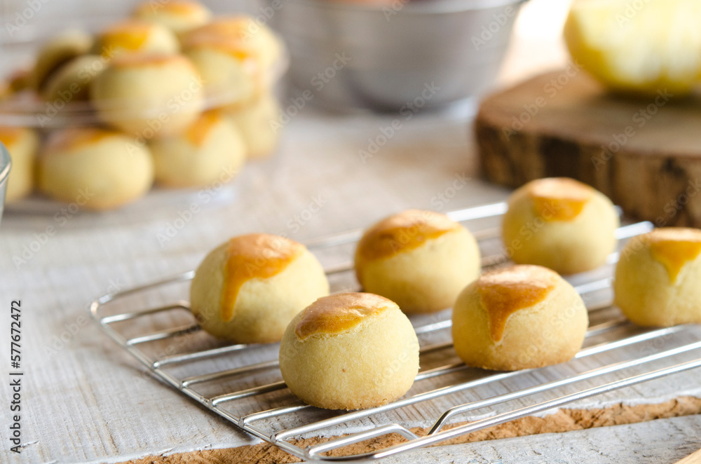 A Pineapple cookies baked for celebrating family time and tradition isolated on wooden table
A Pineapple cookies baked for celebrating family time and tradition isolated on wooden table