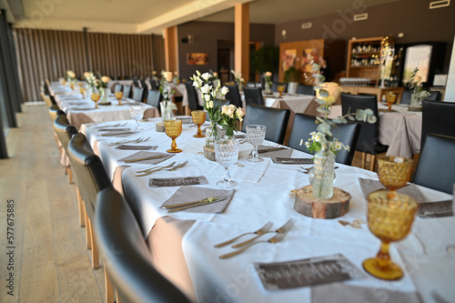 Wedding table in the restaurant decorated with flowers.
