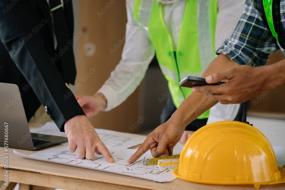 Architect team and Colleagues mixed race, Male engineers or business partners on a construction site, discussing project details. Architect team and Colleagues mixed race, Male engineers or business partners on a construction site, discussing project details.