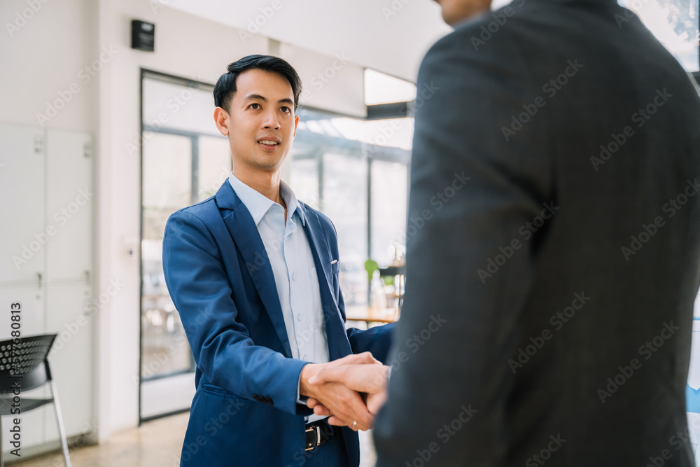 Business people shaking hands, finishing up a meeting. Business people shaking hands, finishing up a meeting.