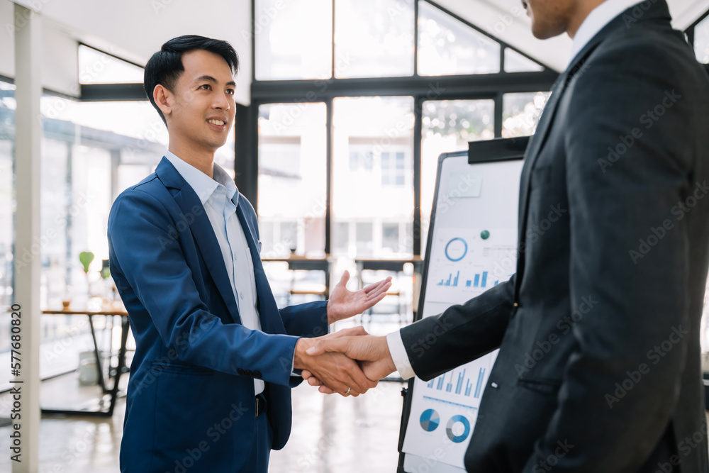 Business people shaking hands, finishing up a meeting. Business people shaking hands, finishing up a meeting.