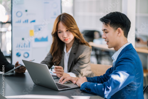 Wallpaper Mural Businessman working as a team start meeting the new marketing project plan By business people using tablets and graph documents Calculate the amount of money for the project. Torontodigital.ca