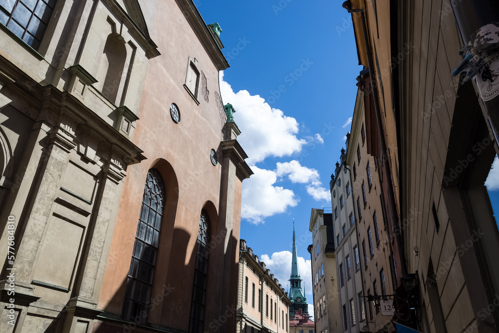 Architectural detail of Gamla stan, the medieval city center of Stockholm, Sweden. In the background, the German Church, sometimes called St. Gertrude's Church 