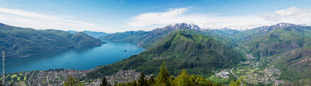 Panoramic view of Lake Maggiore and the city of Locarno and Ascona in a sunny day in Summer, turquoise water and clear sky. Photo taken from the mount Cardada in Ticino, Switzerland