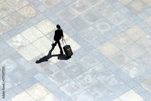 Businesswoman walking across a square