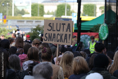 Swedish protester with sign in Swedish: 