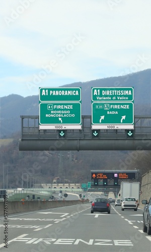 Road Signal at crossroad and name of two way to Florence called DIRETTISSIMA Variante di Valico in Central Italy photo