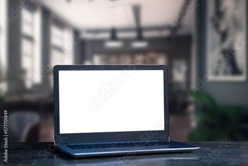 Wallpaper Mural Laptop computer on desk at office or co-working space, Laptop with white blank on screen and blurred background , working space concept. Torontodigital.ca